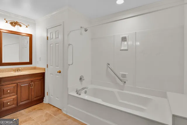 a living room with furniture a fireplace and kitchen view