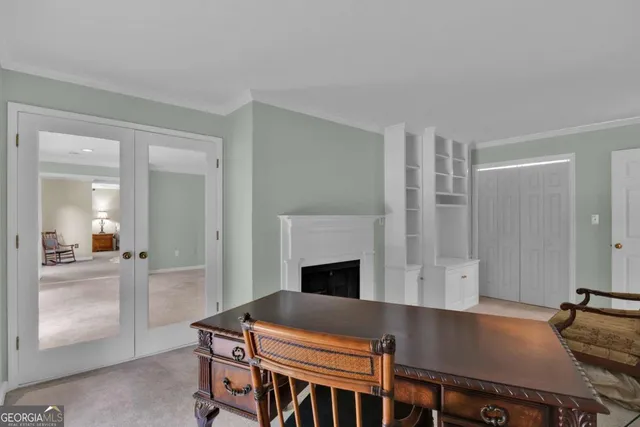 a living room with furniture and a chair