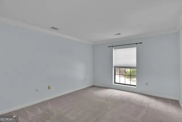 a view of a house with sitting area and garden