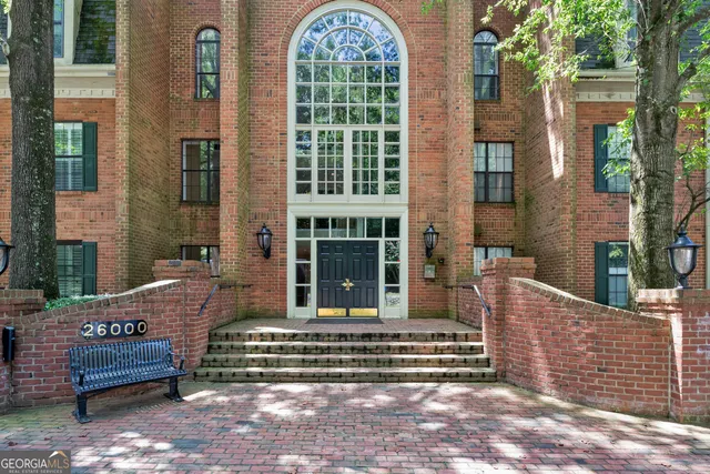 an outdoor space with patio and white umbrellas