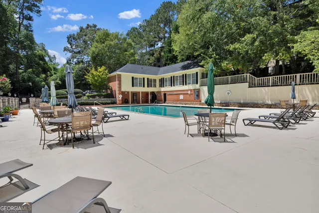 a view of an empty room with a window and fireplace