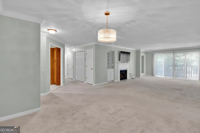 a kitchen with a refrigerator a sink and a stove top oven