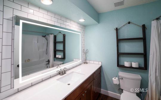 313 East Haloid Avenue Ridgecrest, CA 93555 - Photo 22 of 39 a bathroom with a sink a toilet and shower