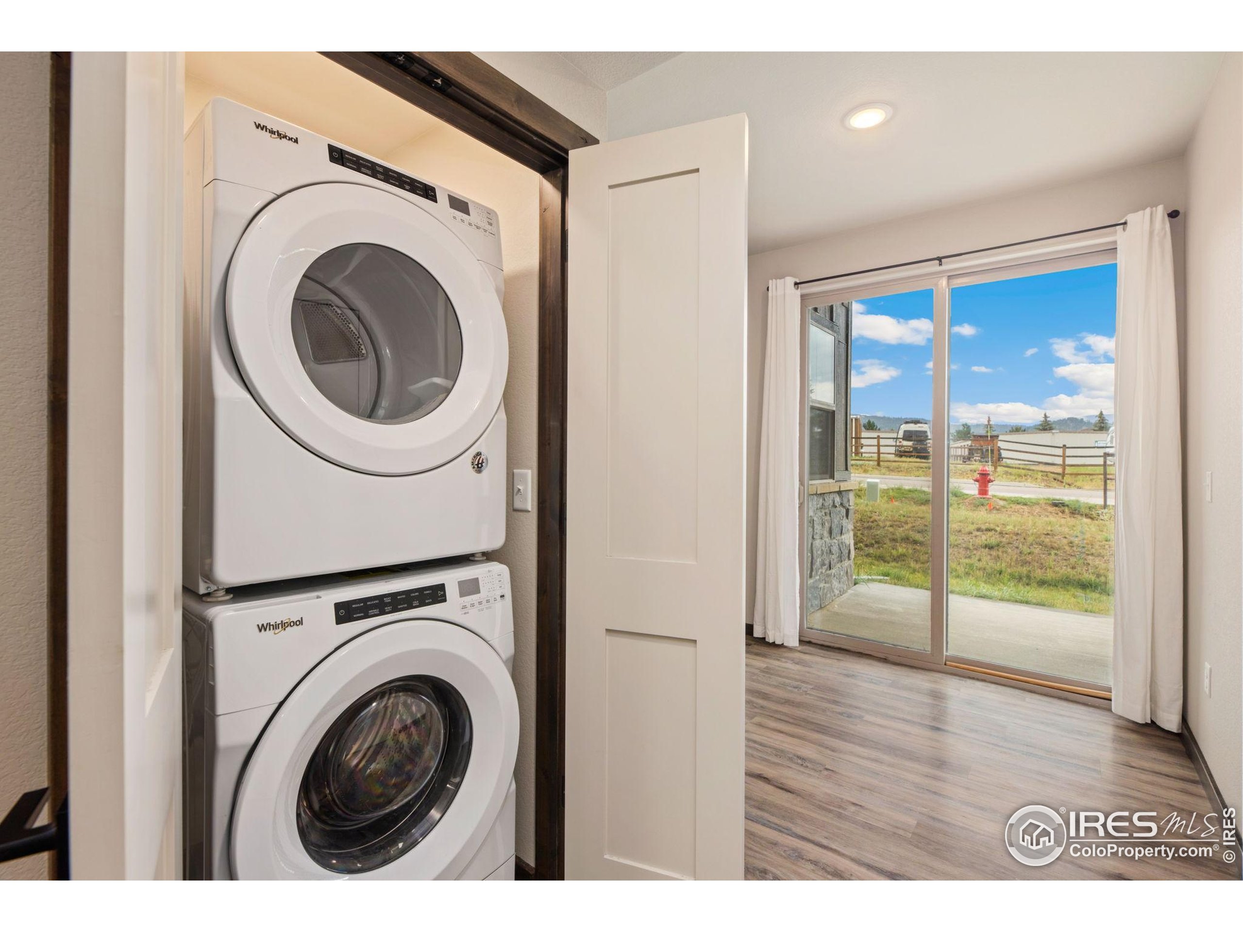 1734 Wildfire Road, Unit 102 Estes Park, CO 80517 - Photo 11 of 33 a view of a hallway with washer and dryer
