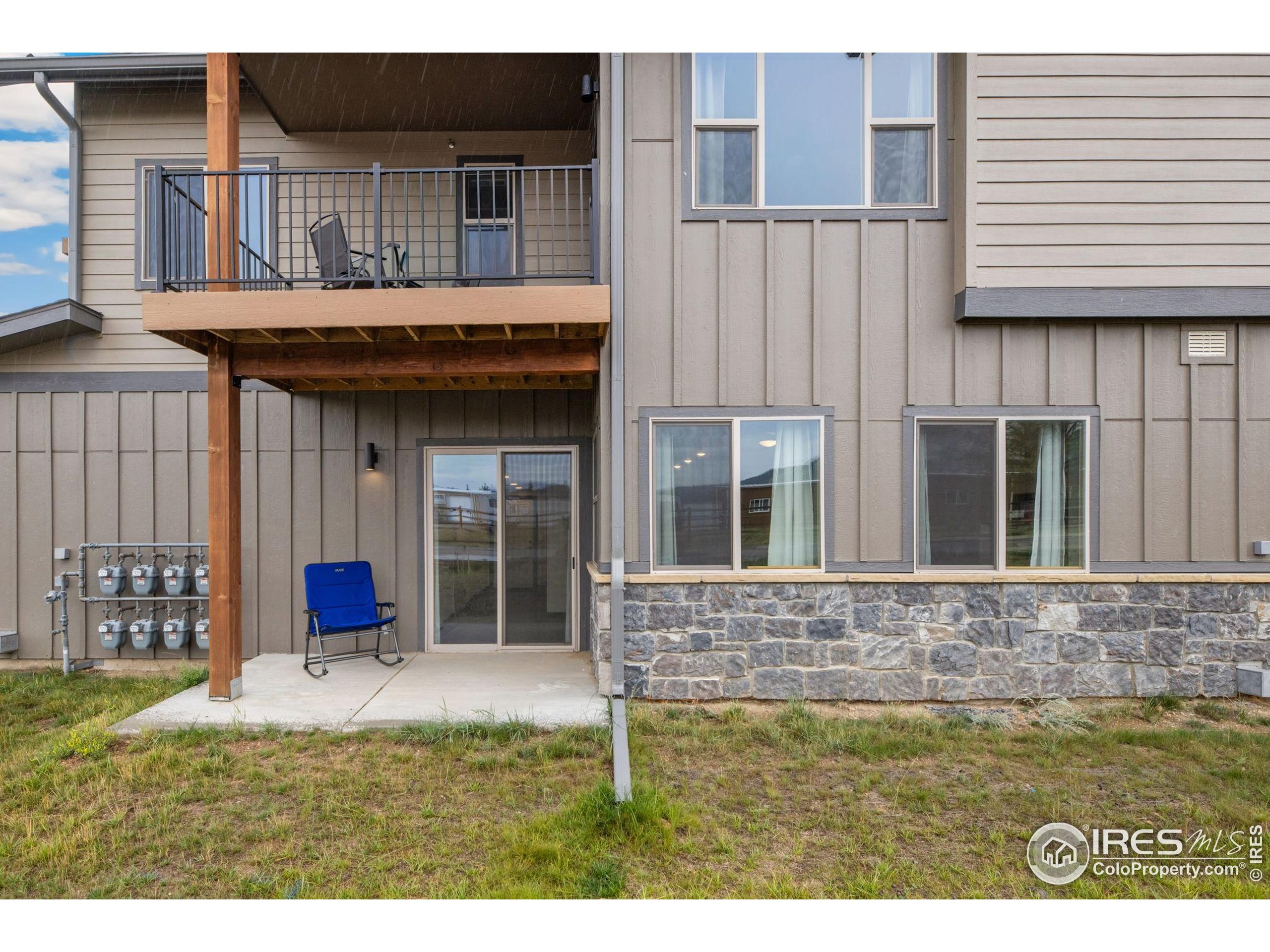 1734 Wildfire Road, Unit 102 Estes Park, CO 80517 - Photo 26 of 33 a view of a house with a porch