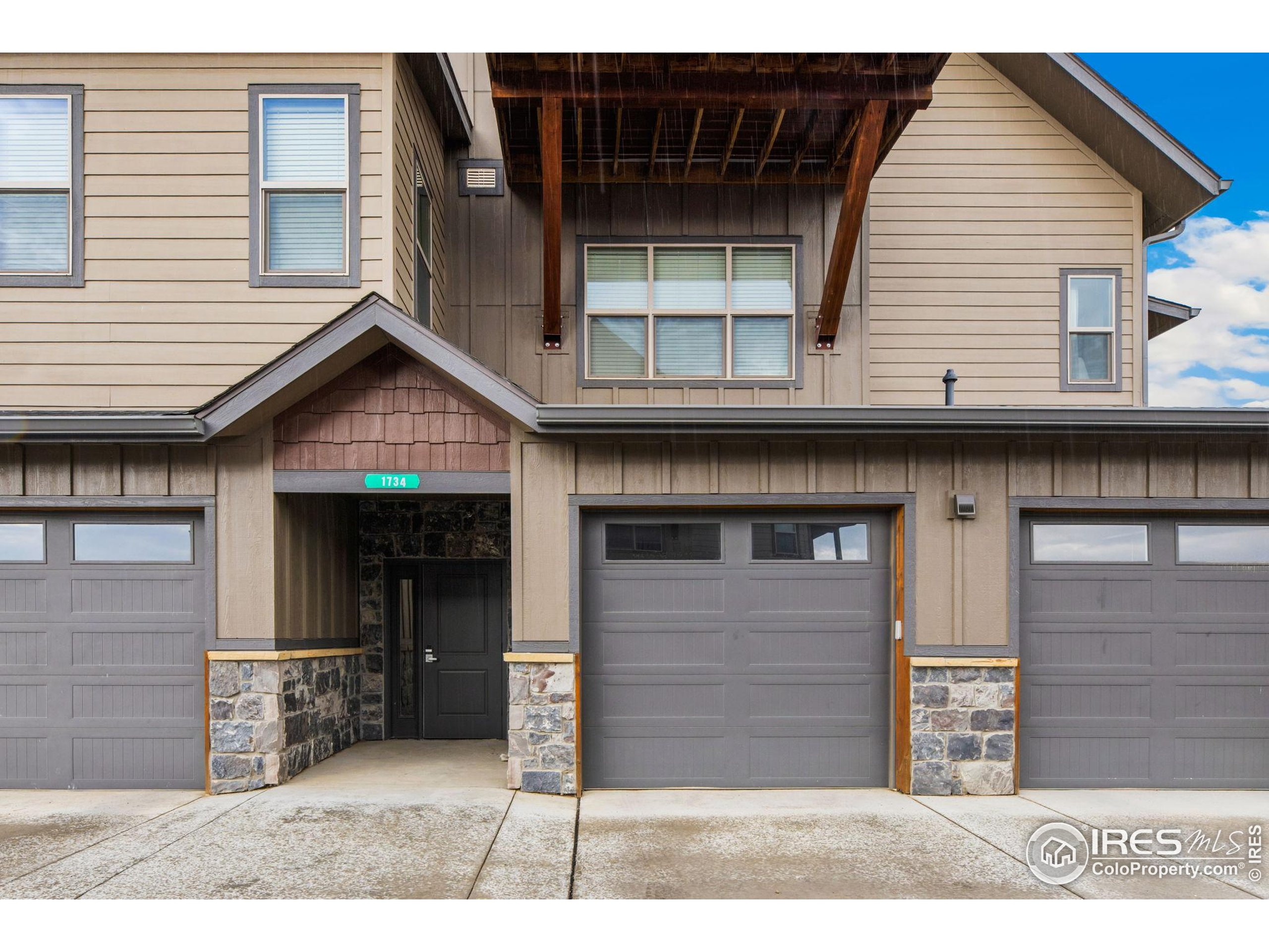 1734 Wildfire Road, Unit 102 Estes Park, CO 80517 - Photo 27 of 33 a view of a house with wooden deck