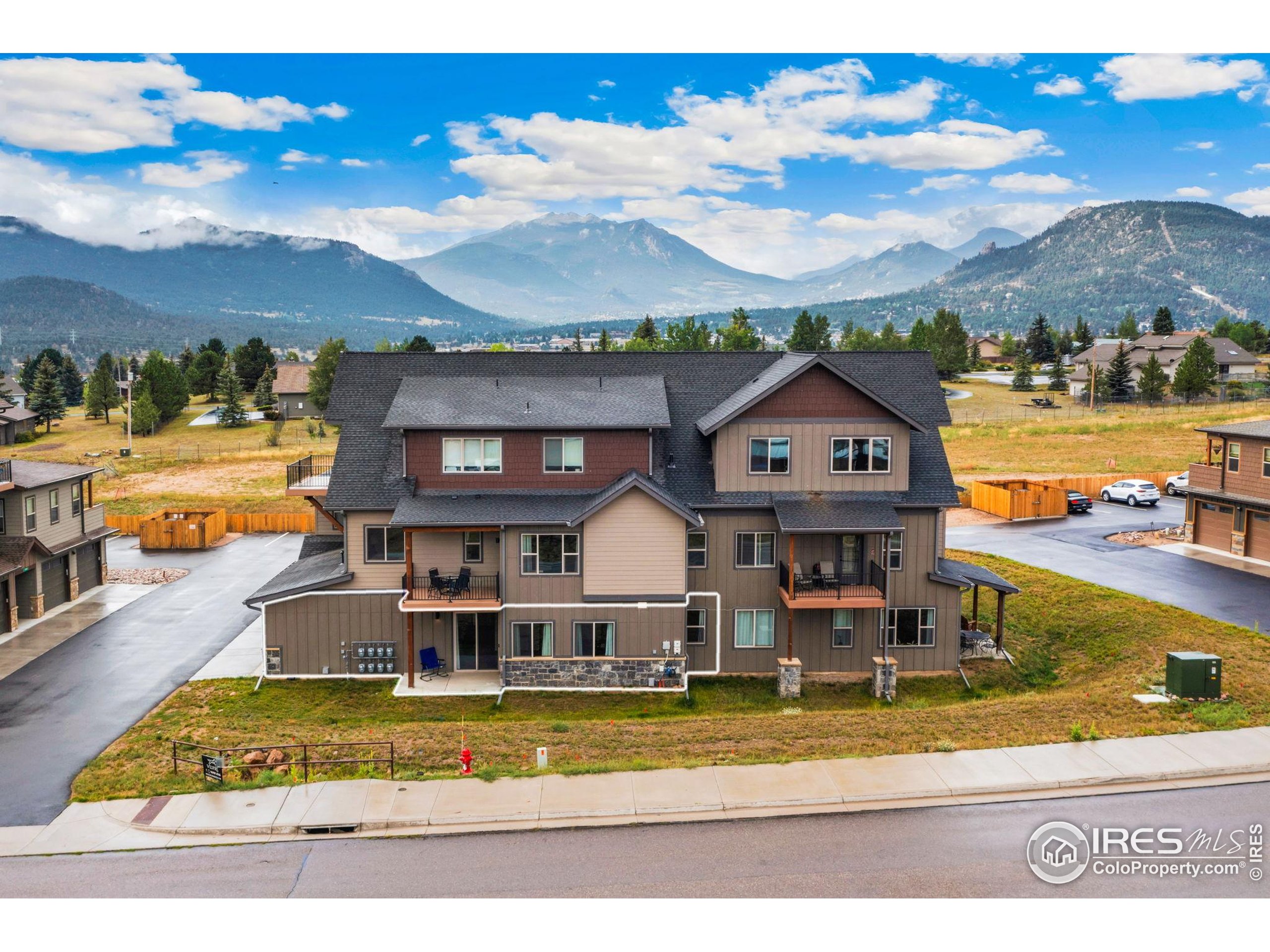1734 Wildfire Road, Unit 102 Estes Park, CO 80517 - Photo 30 of 33 a view of a house with a big yard