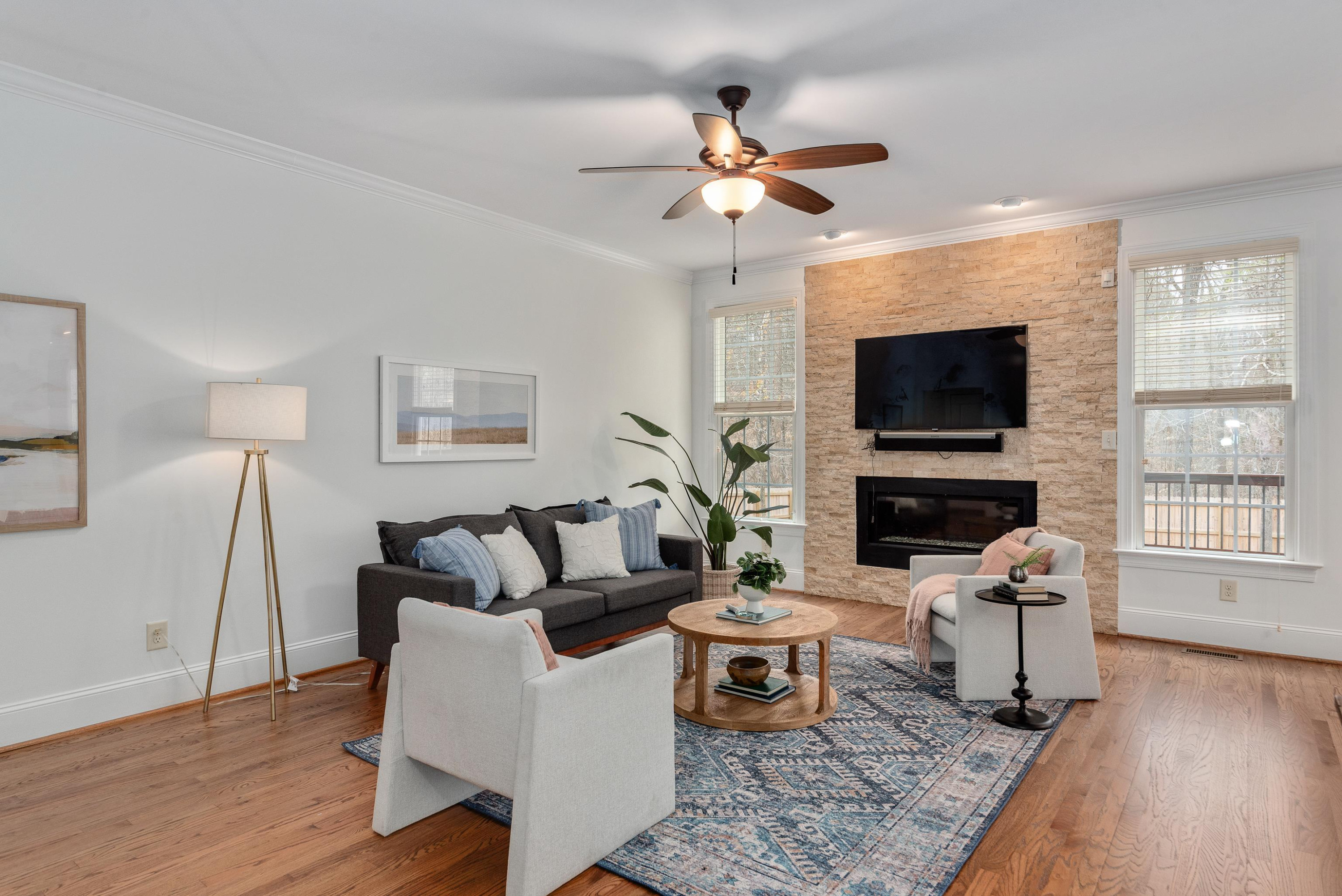 8031 Sundance Circle Durham, NC 27713 - Photo 6 of 35 a living room with furniture a fireplace and a flat screen tv