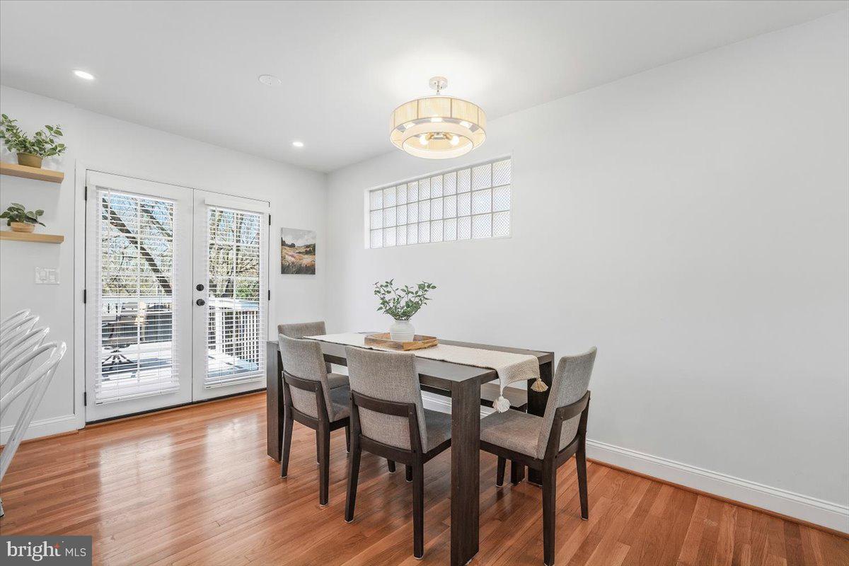 10302 Conover Drive Silver Spring, MD 20902 - Photo 11 of 44 a view of a dining room with furniture wooden floor and a chandelier