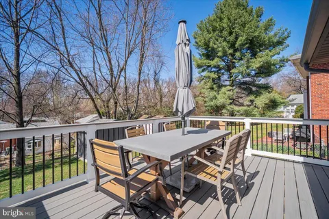 a view of a chairs and table on the deck