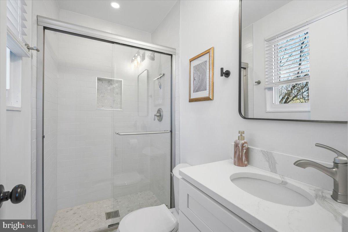 10302 Conover Drive Silver Spring, MD 20902 - Photo 24 of 44 a bathroom with a sink toilet and shower