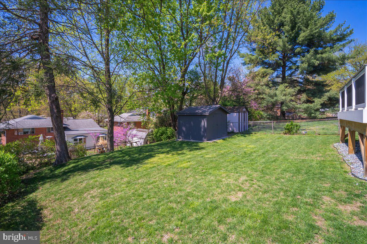 10302 Conover Drive Silver Spring, MD 20902 - Photo 36 of 44 a backyard of a house with lots of green space