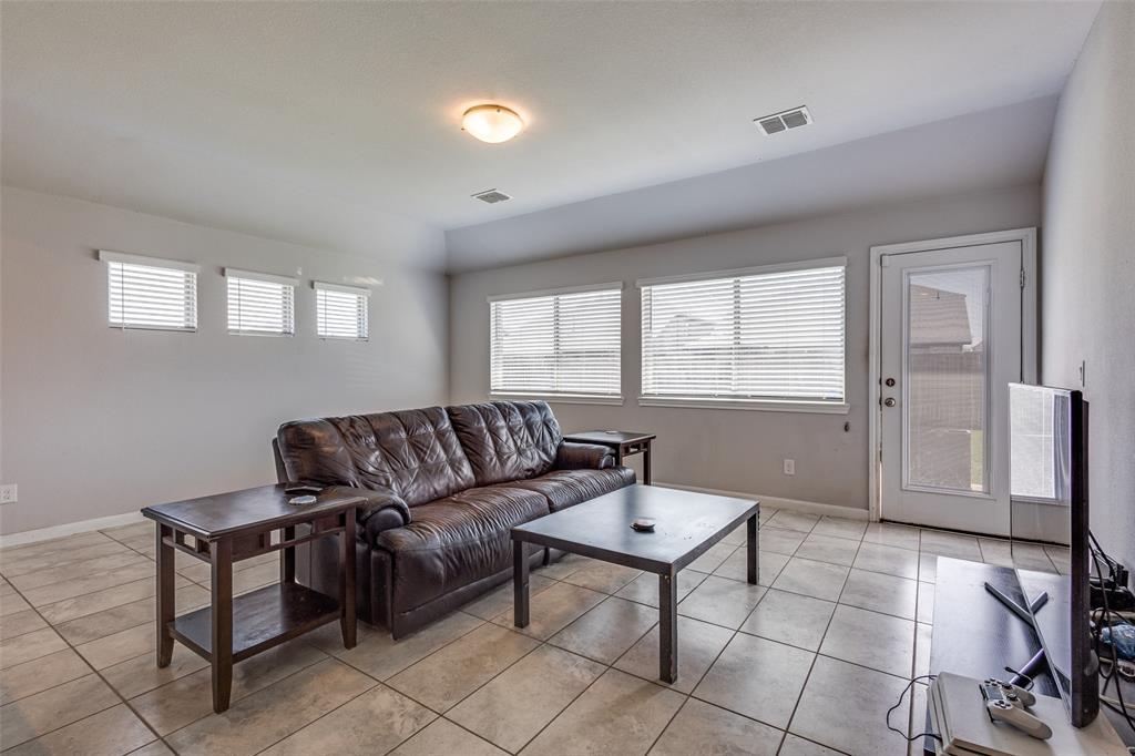 1404 Rosebush Road Aubrey, TX 76227 - Photo 12 of 25 a living room with furniture and a window