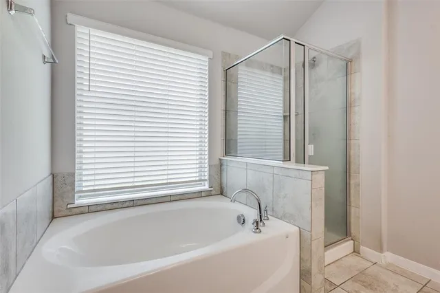 a white bath tub sitting next to a window