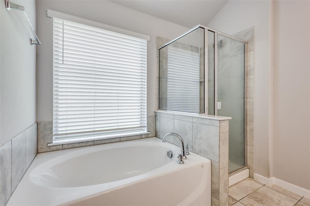 1404 Rosebush Road Aubrey, TX 76227 - Photo 17 of 25 a white bath tub sitting next to a window