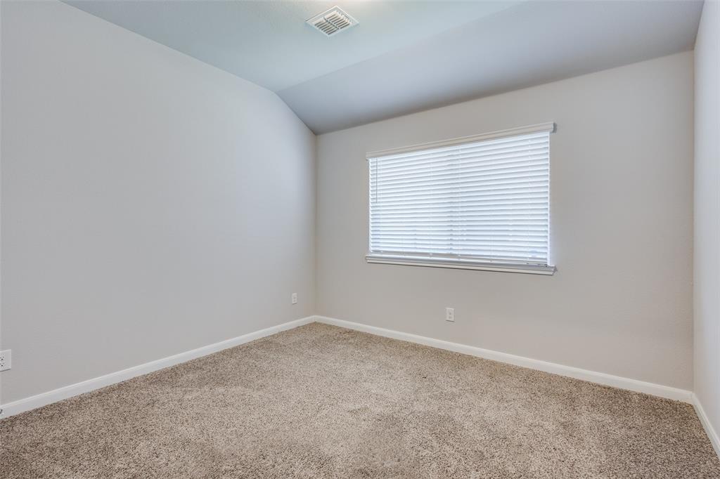 1404 Rosebush Road Aubrey, TX 76227 - Photo 22 of 25 an empty room with a window