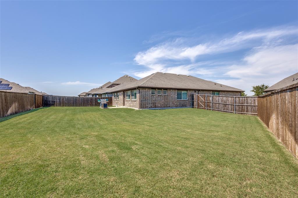 1404 Rosebush Road Aubrey, TX 76227 - Photo 24 of 25 a view of a house with a backyard