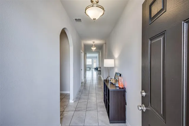 a hallway with a view of living room