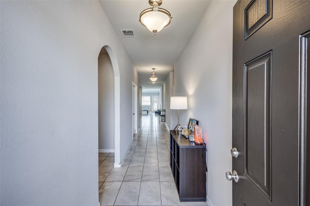 1404 Rosebush Road Aubrey, TX 76227 - Photo 3 of 25 a hallway with a view of living room