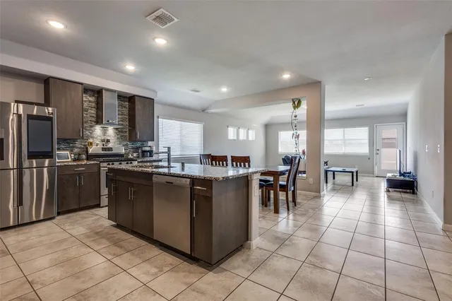 a kitchen with lots of counter top space and appliances