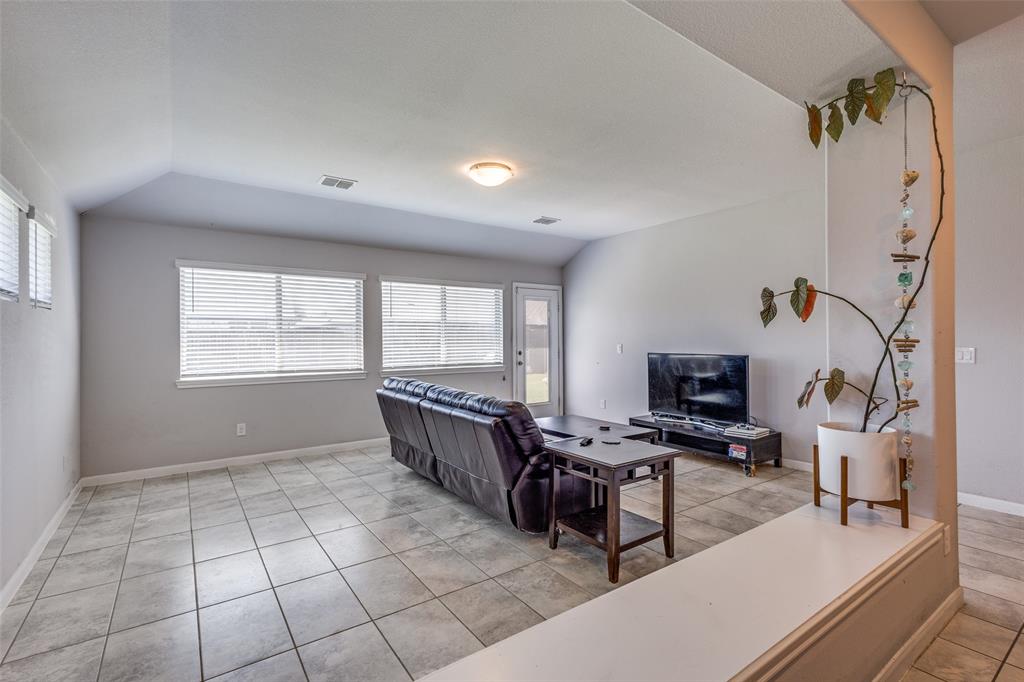 1404 Rosebush Road Aubrey, TX 76227 - Photo 9 of 25 a room with furniture and a window