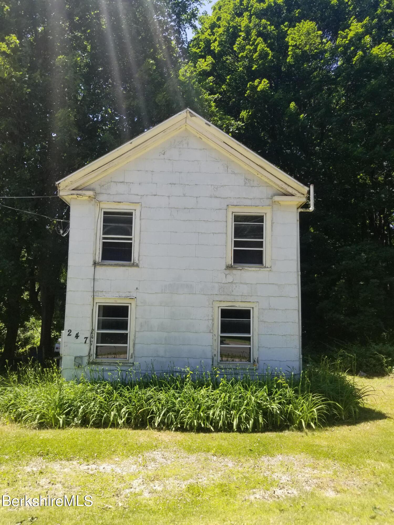 247 Pecks Road Pittsfield, MA 01201 - Photo 2 of 13 a front view of house with a garden