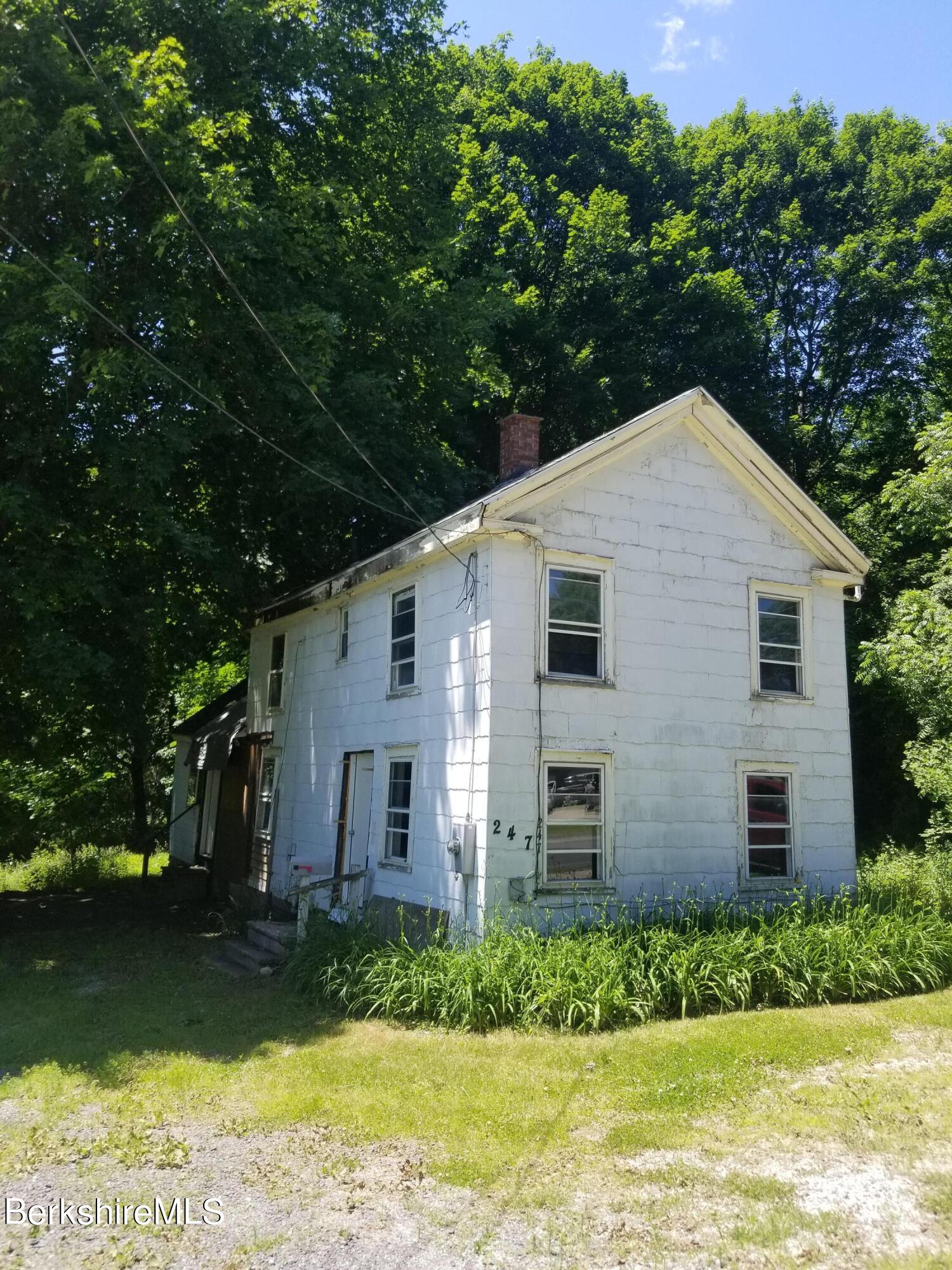247 Pecks Road Pittsfield, MA 01201 - Photo 3 of 13 a view of a house with a yard