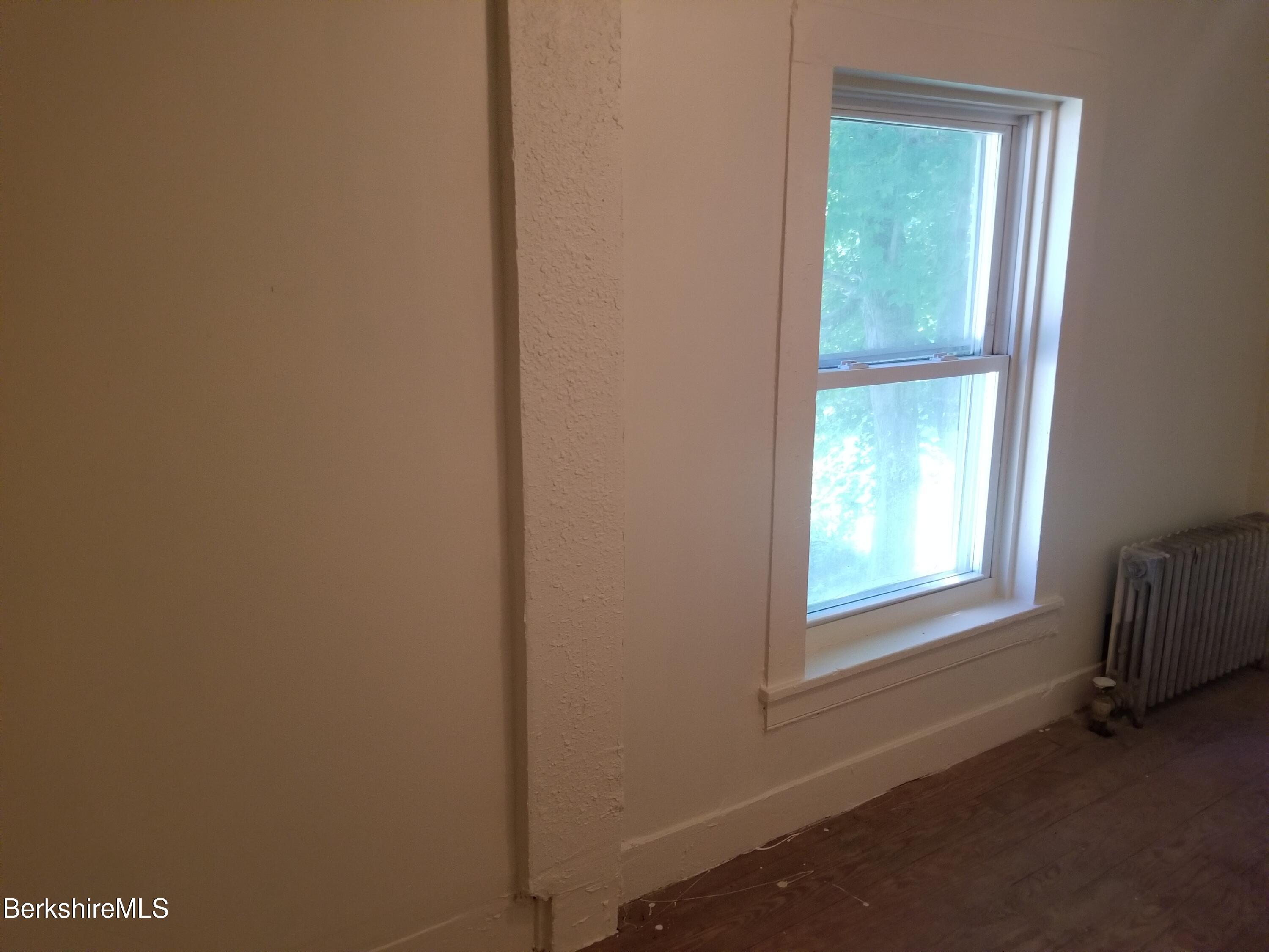 247 Pecks Road Pittsfield, MA 01201 - Photo 9 of 13 a room that has a window in it
