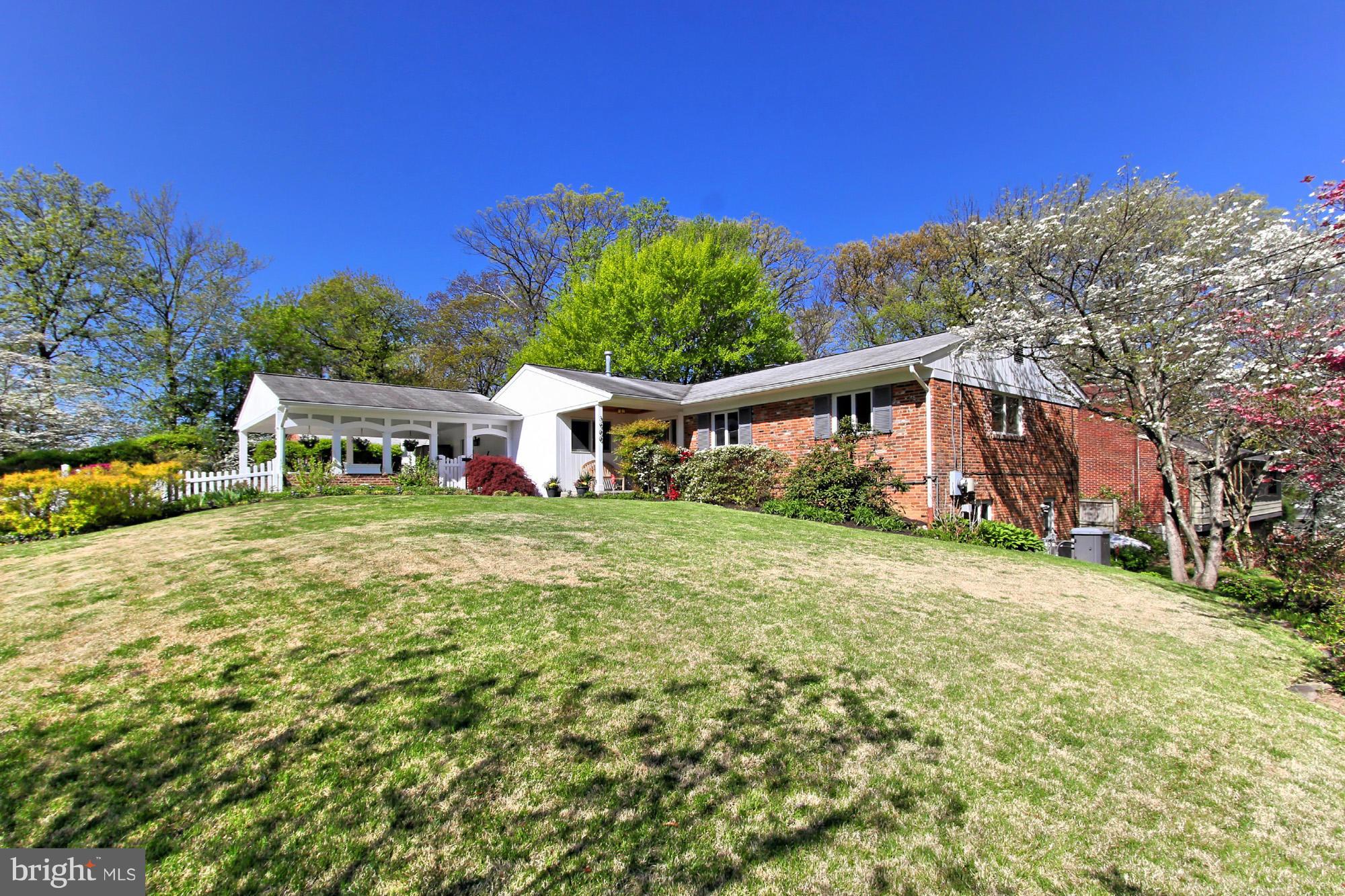 3900 Chesterbrook Road Arlington, VA 22207 - Photo 1 of 30 a front view of a house with garden