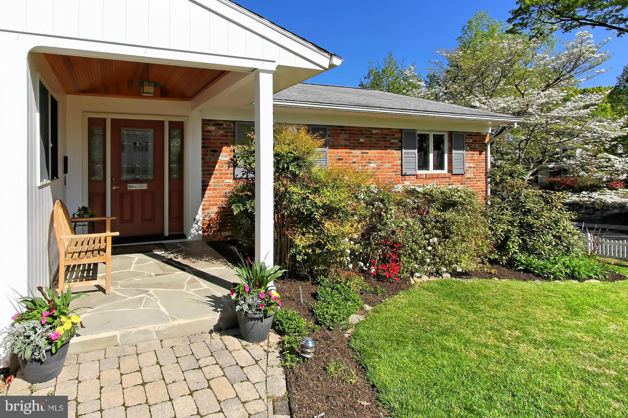 3900 Chesterbrook Road Arlington, VA 22207 - Photo 3 of 30 a front view of a house with garden