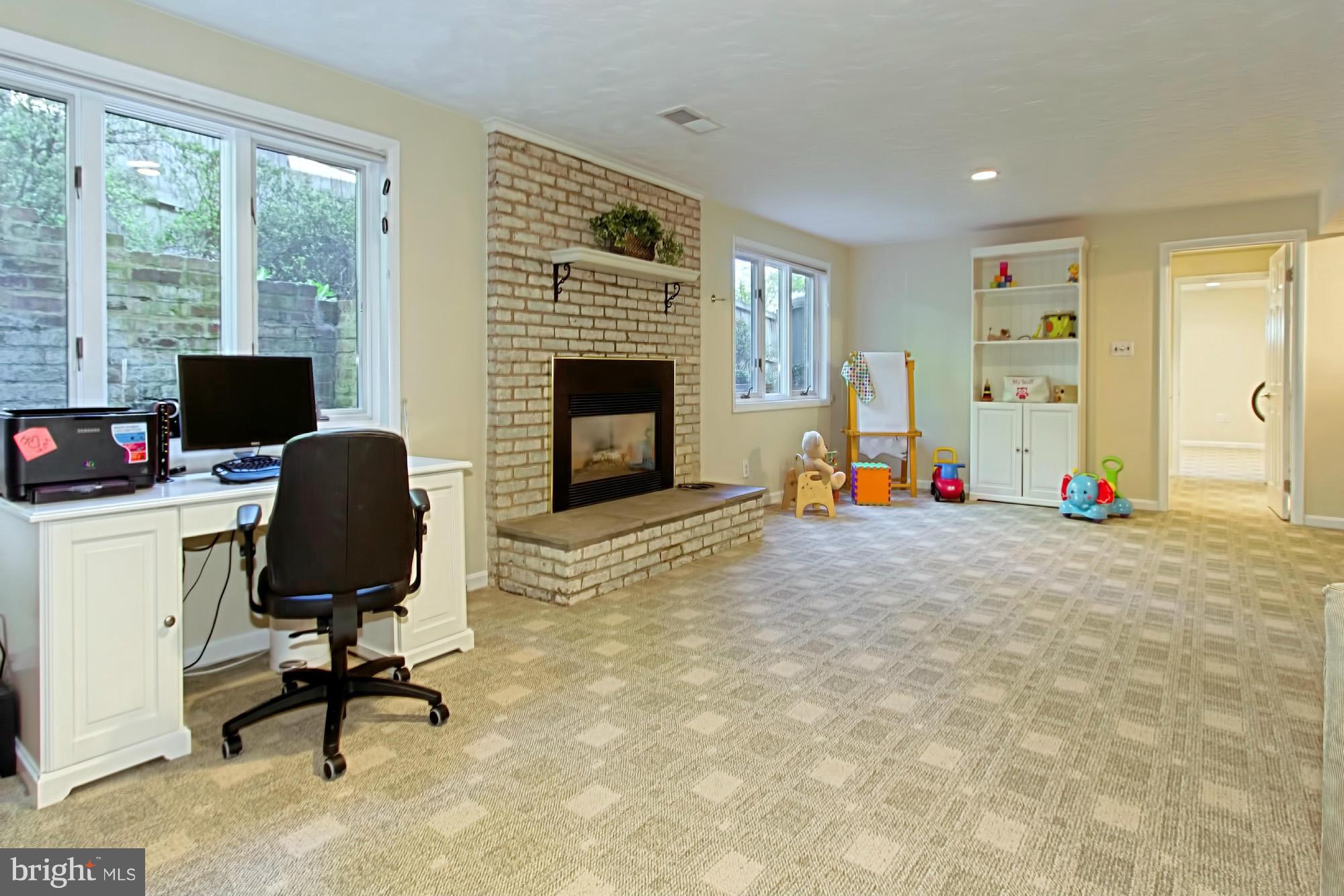 3900 Chesterbrook Road Arlington, VA 22207 - Photo 23 of 30 a view of a workspace with furniture and a window