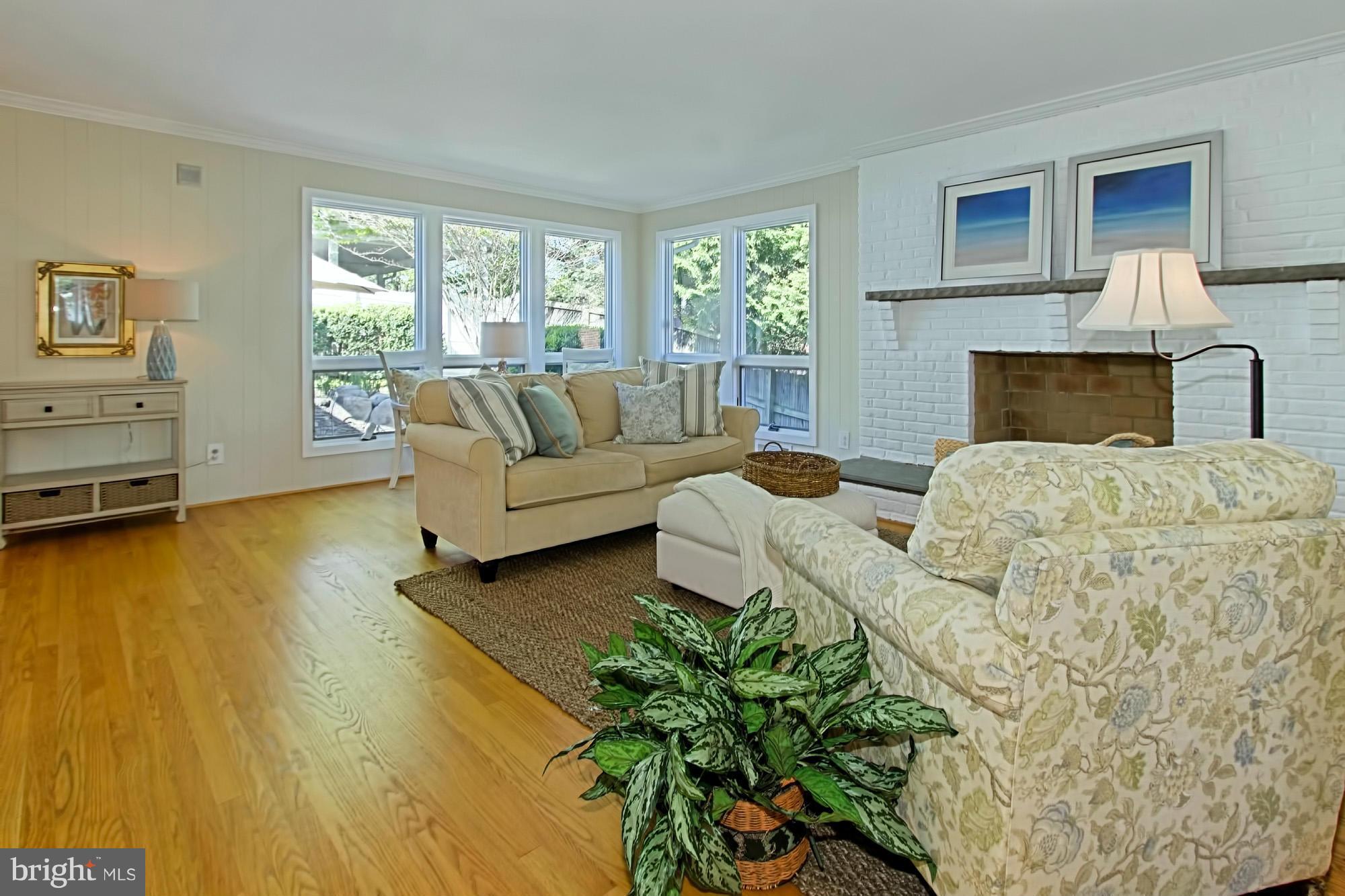3900 Chesterbrook Road Arlington, VA 22207 - Photo 4 of 30 a living room with furniture and a fireplace