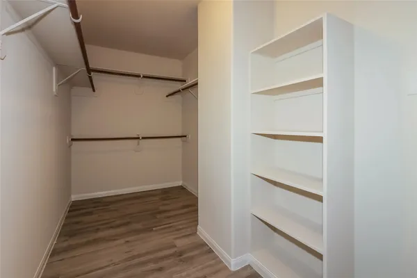 a view of an empty walk in closet