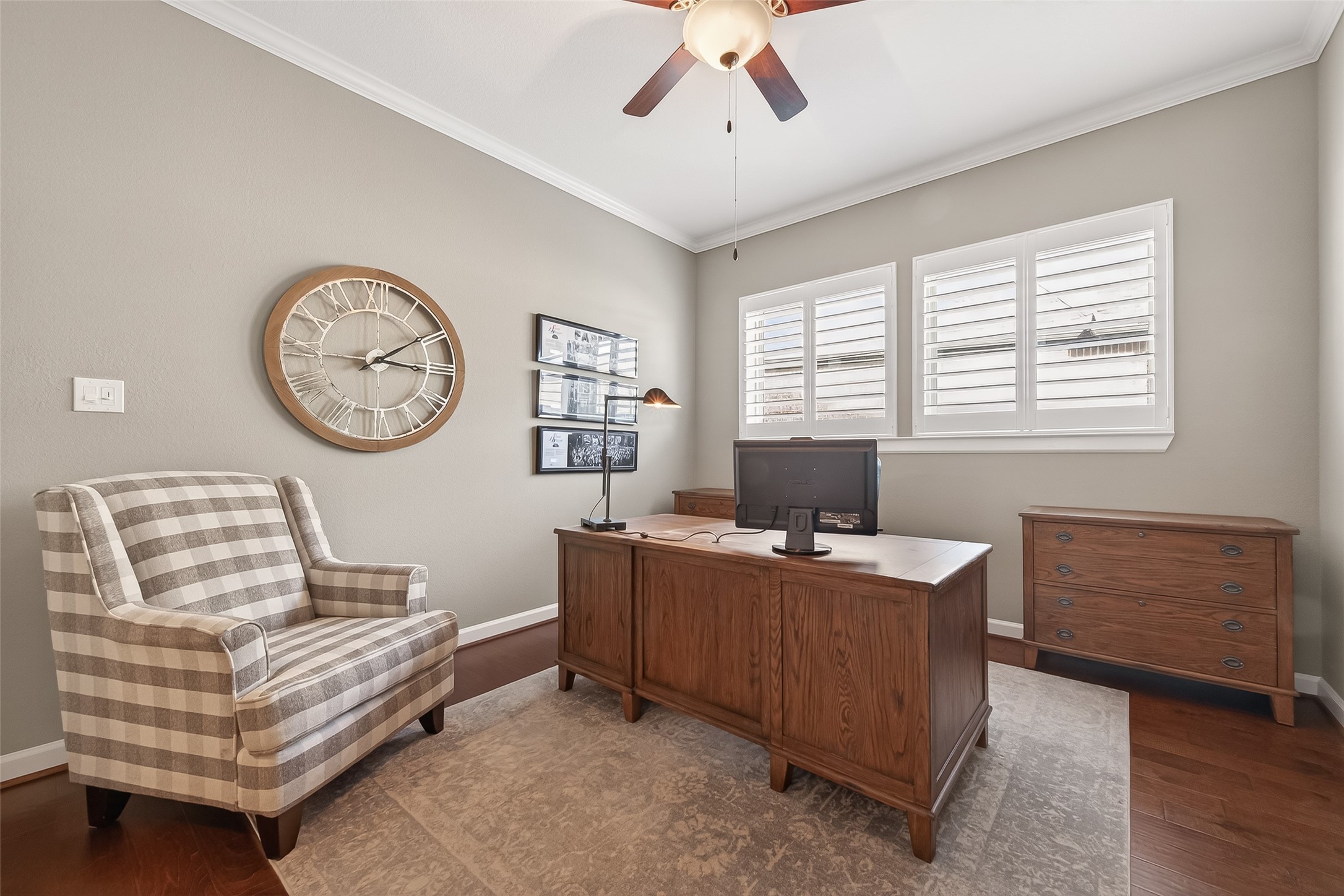 1307 Layla Sage Loop Richmond, TX 77406 - Photo 13 of 50 A dedicated home office with double glass doors, ceiling fan, and dual windows provides a bright and inspiring workspace.