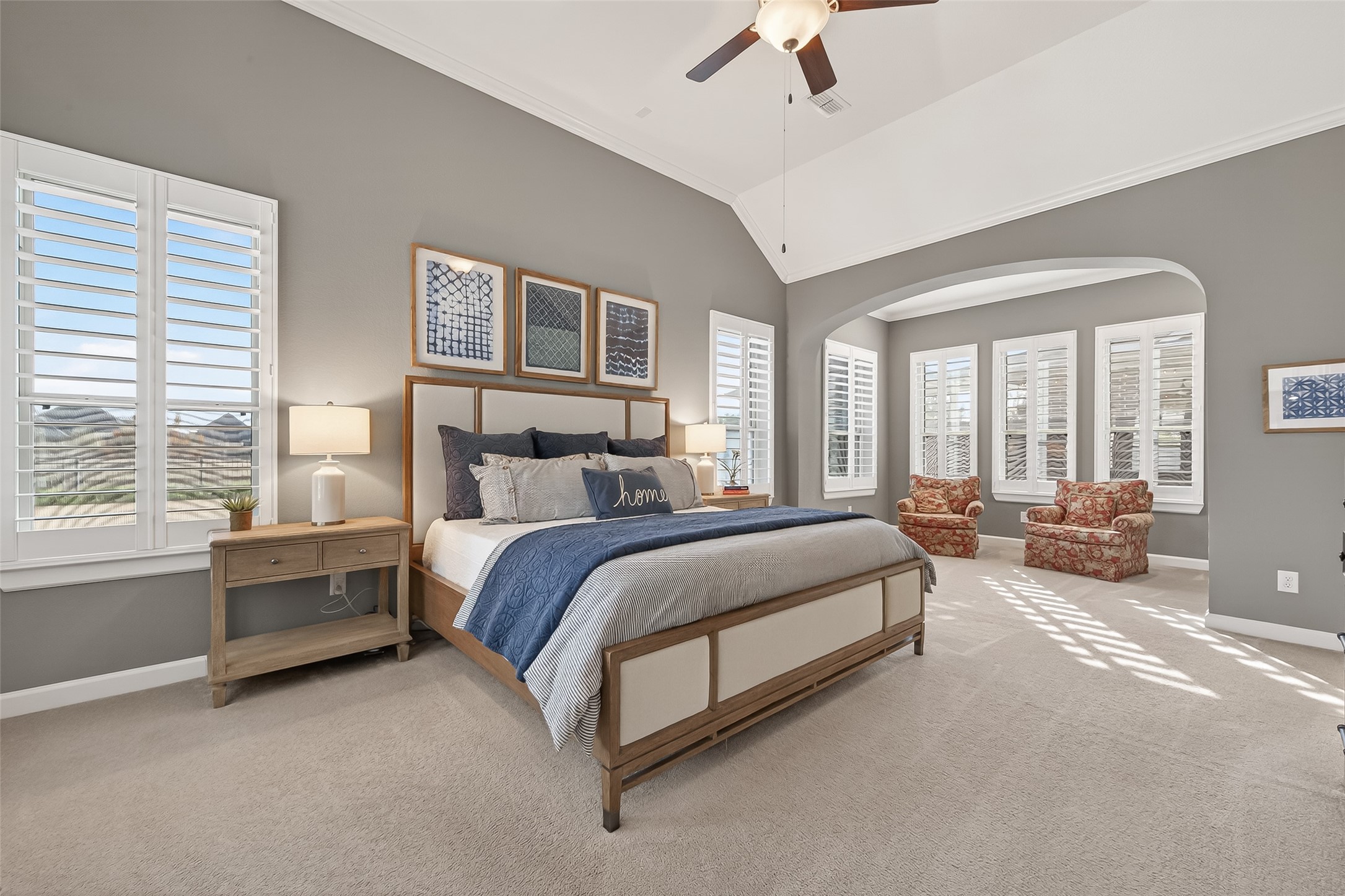 1307 Layla Sage Loop Richmond, TX 77406 - Photo 36 of 50 The primary suite, tucked away at the back of the home, is a true sanctuary. Enjoy peaceful backyard and lake views, a sitting area, high ceilings, and luxurious finishes.