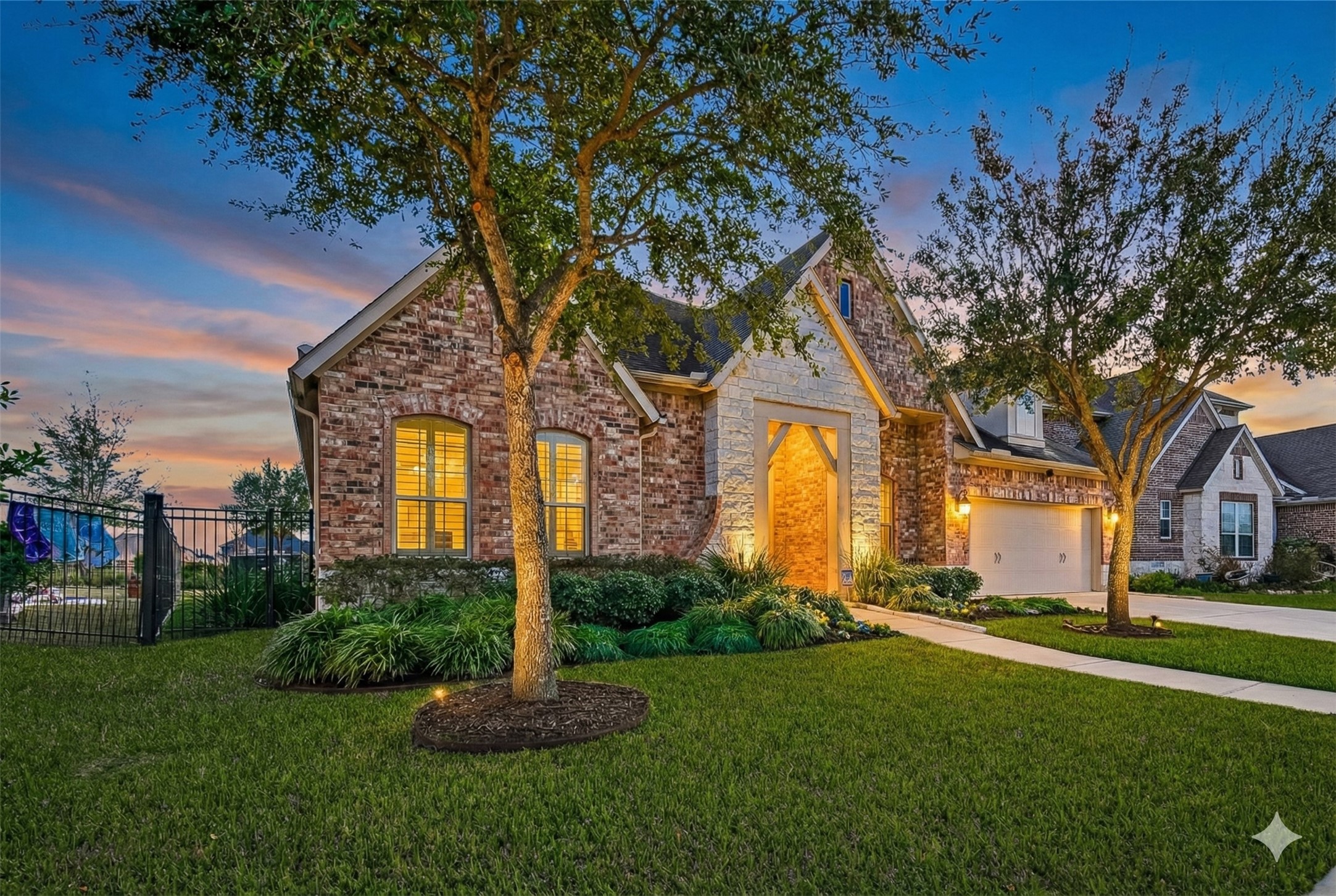 1307 Layla Sage Loop Richmond, TX 77406 - Photo 4 of 50 With its premium lot, lake views, direct walking path access, flexible layout, and high-end finishes, this home offers a rare combination of privacy, beauty, and functionality! A place where memories are made and everyday living feels extraordinary. ***Twilight Enhanced Photos***