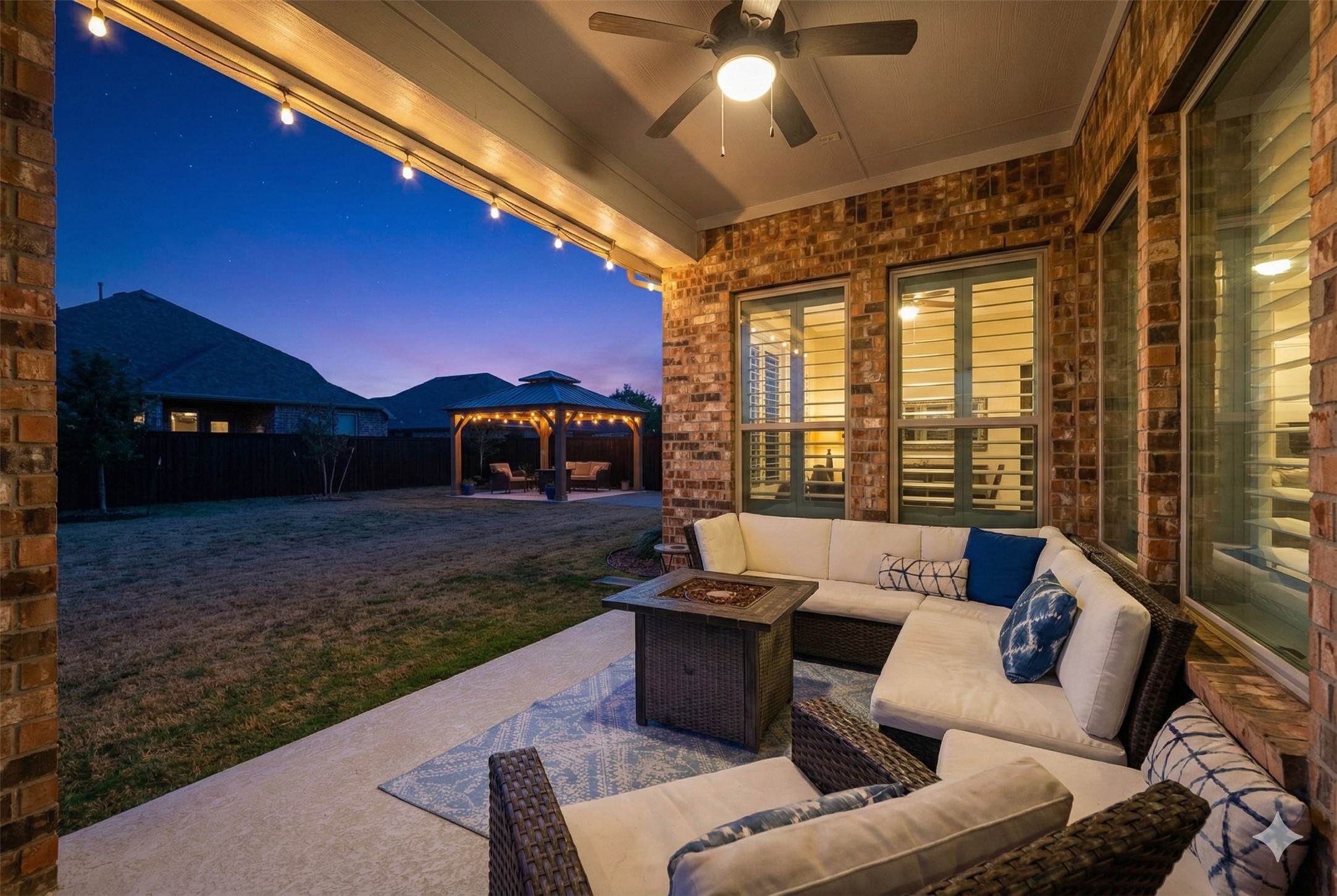 1307 Layla Sage Loop Richmond, TX 77406 - Photo 42 of 50 Step outside to an extended covered patio (upgrade) and spacious backyard! ***Twilight Enhanced Photos***