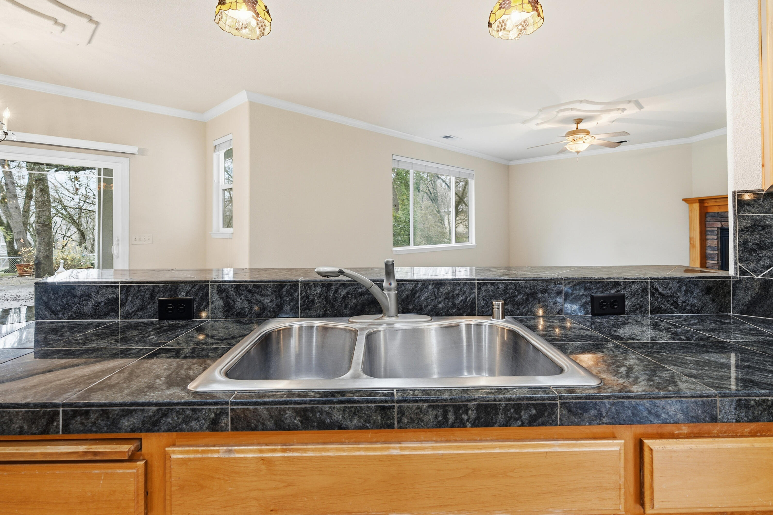 14535 Molluc Drive Red Bluff, CA 96080 - Photo 12 of 72 a kitchen with granite countertop a sink and a stove top oven