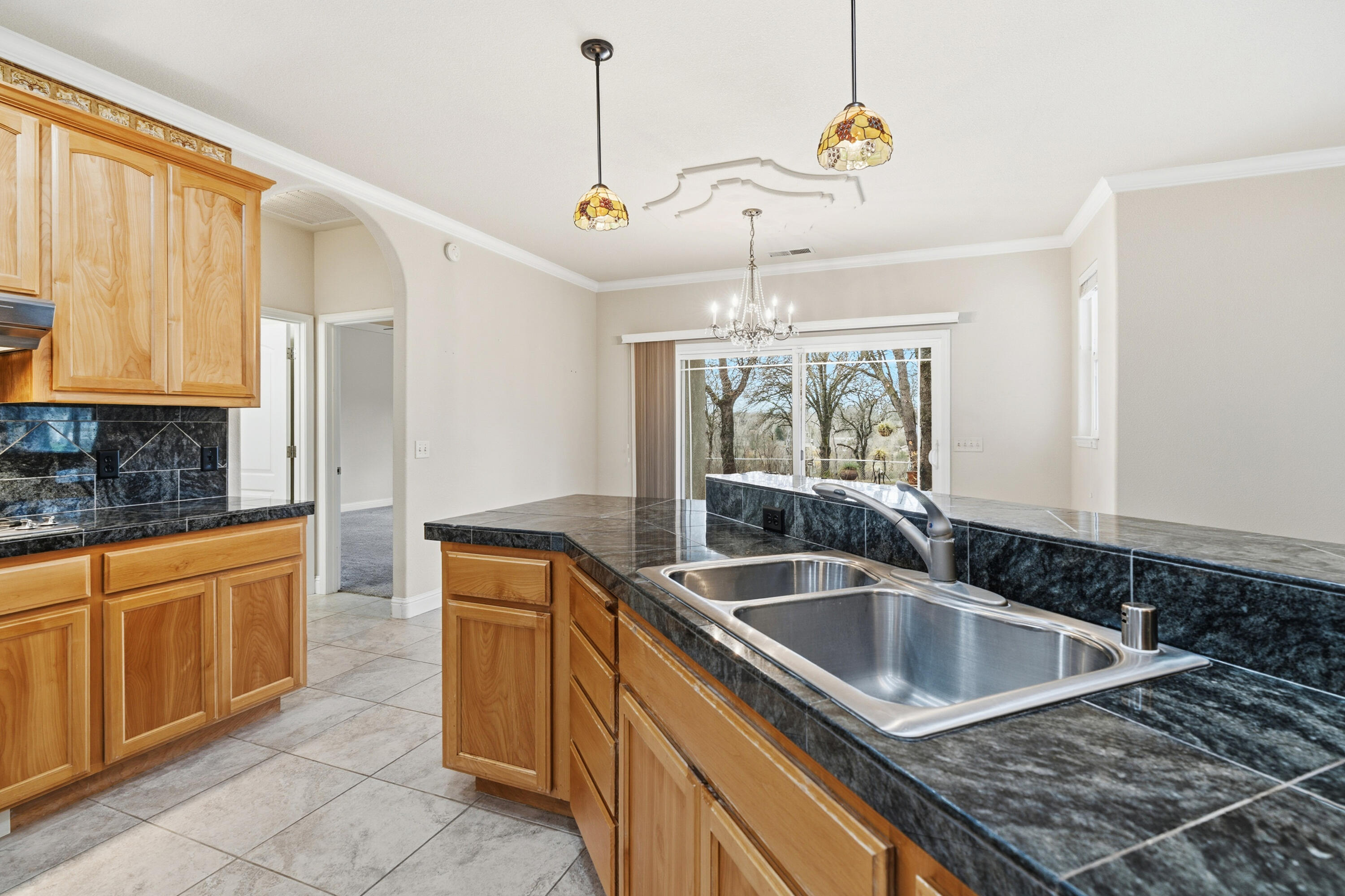 14535 Molluc Drive Red Bluff, CA 96080 - Photo 14 of 72 a kitchen that has a sink stove and cabinets