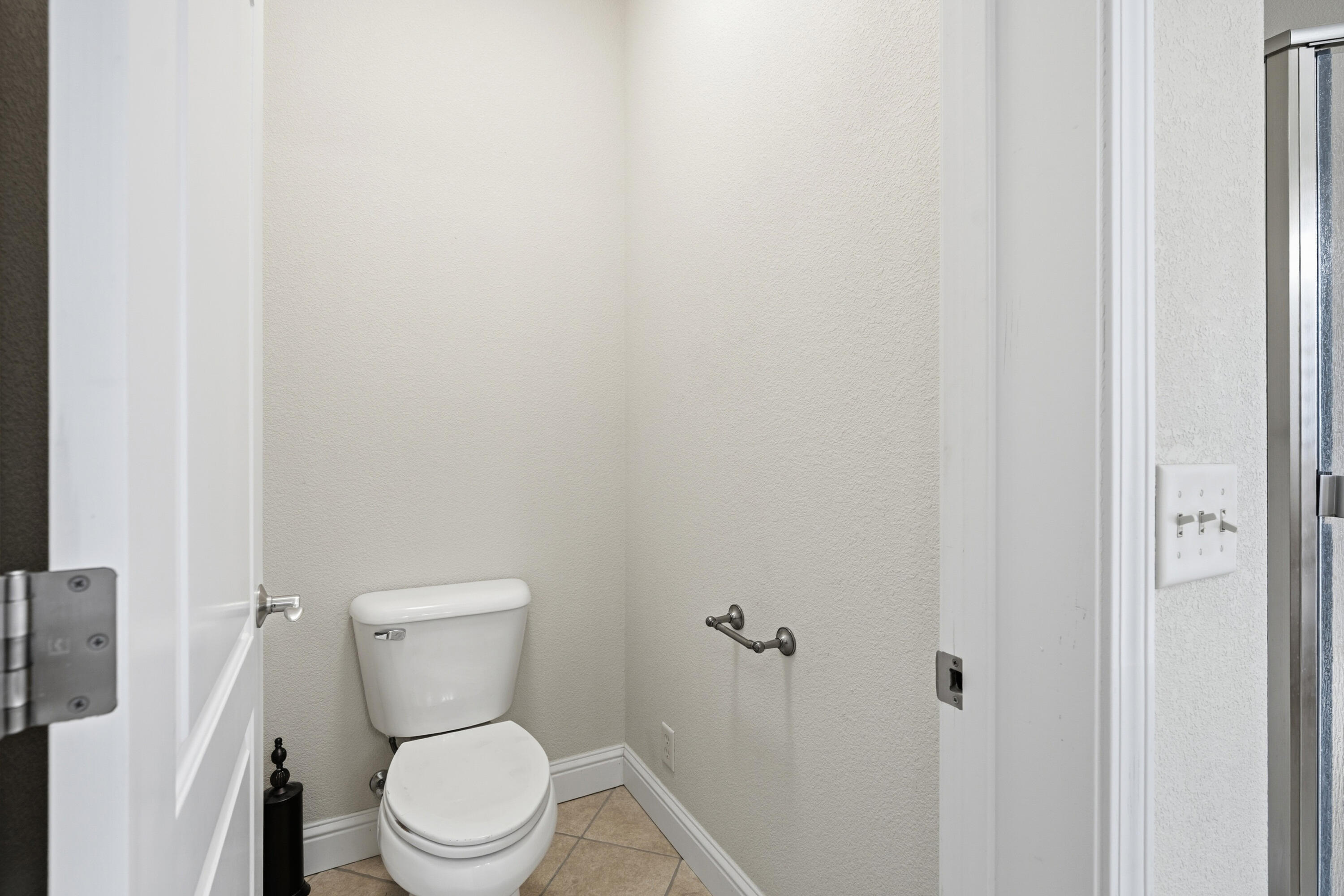 14535 Molluc Drive Red Bluff, CA 96080 - Photo 23 of 72 a white toilet sitting next to a white cabinet