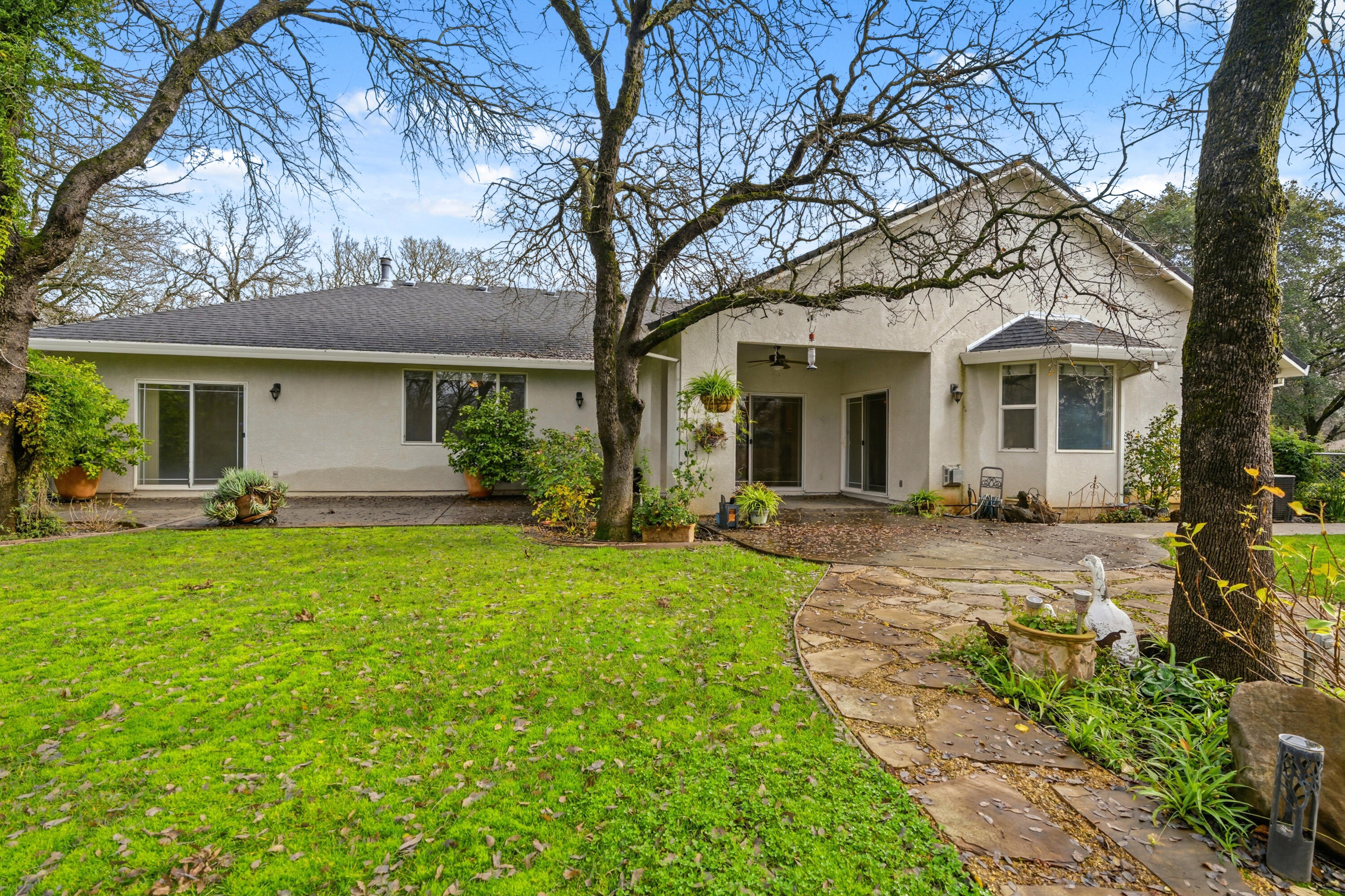 14535 Molluc Drive Red Bluff, CA 96080 - Photo 35 of 72 a front view of a house with a garden and yard