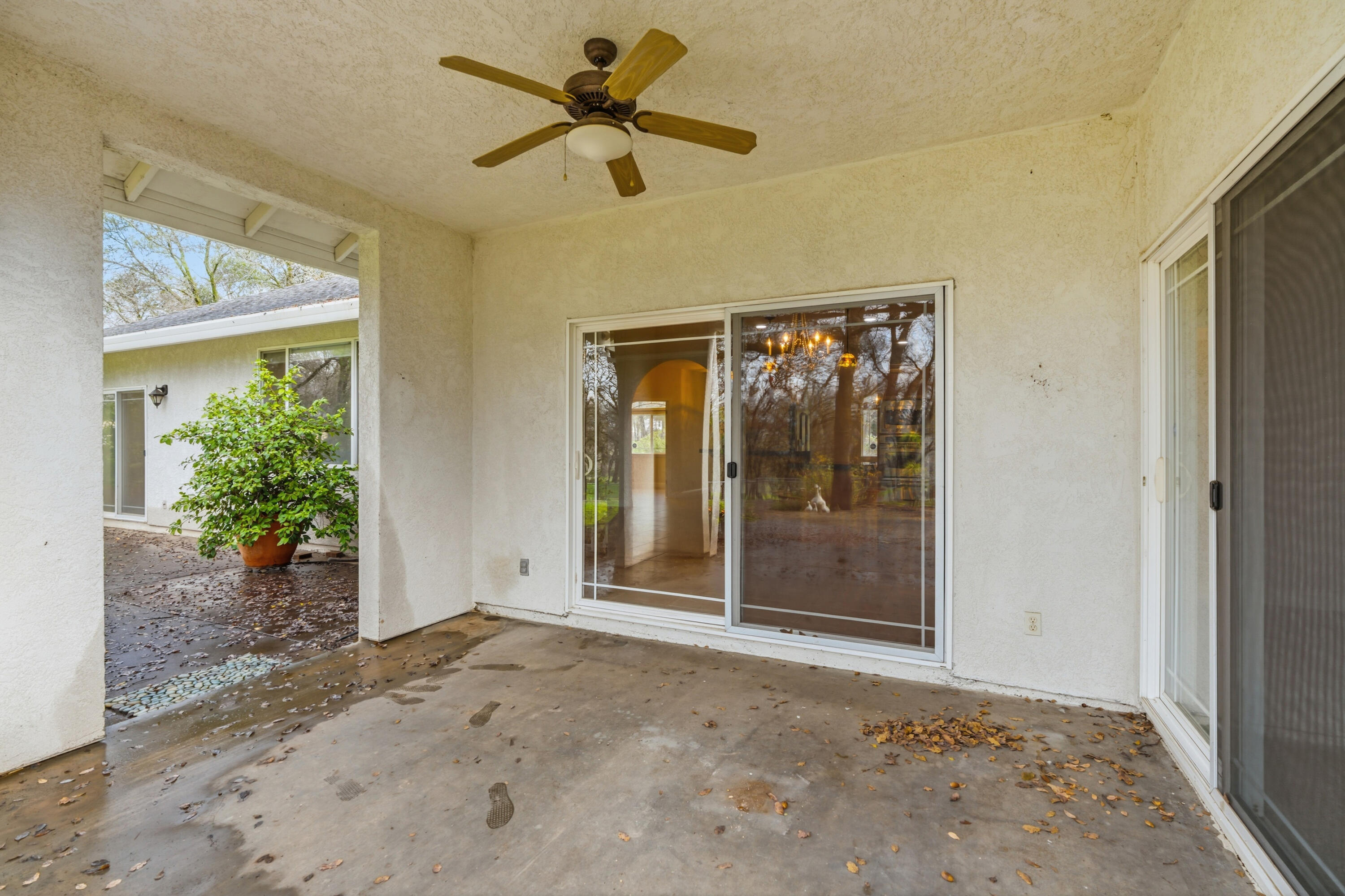 14535 Molluc Drive Red Bluff, CA 96080 - Photo 38 of 72 a view of a big room with wooden floor and a ceiling fan
