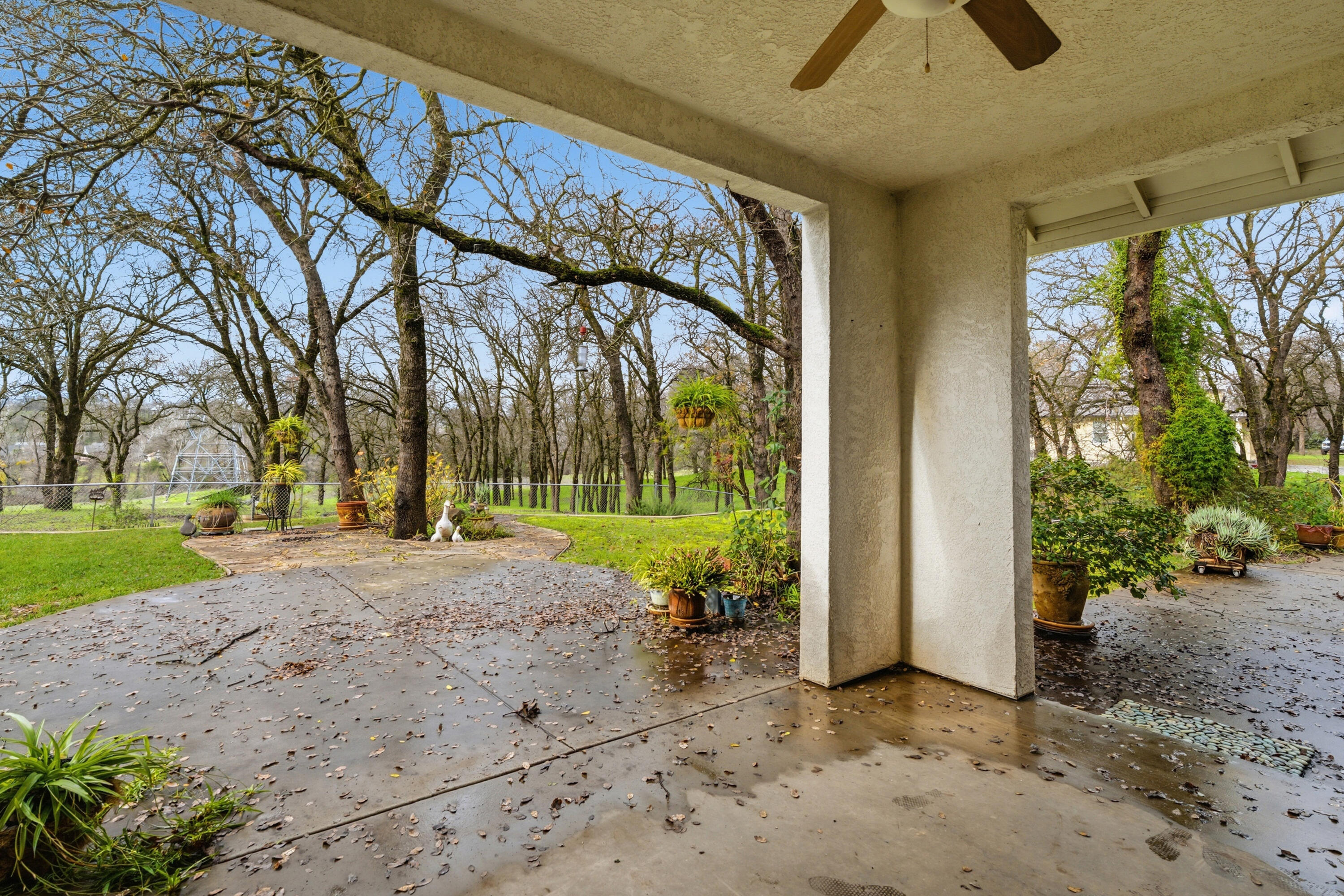 14535 Molluc Drive Red Bluff, CA 96080 - Photo 39 of 72 a view of a porch with a table and chairs under an umbrella