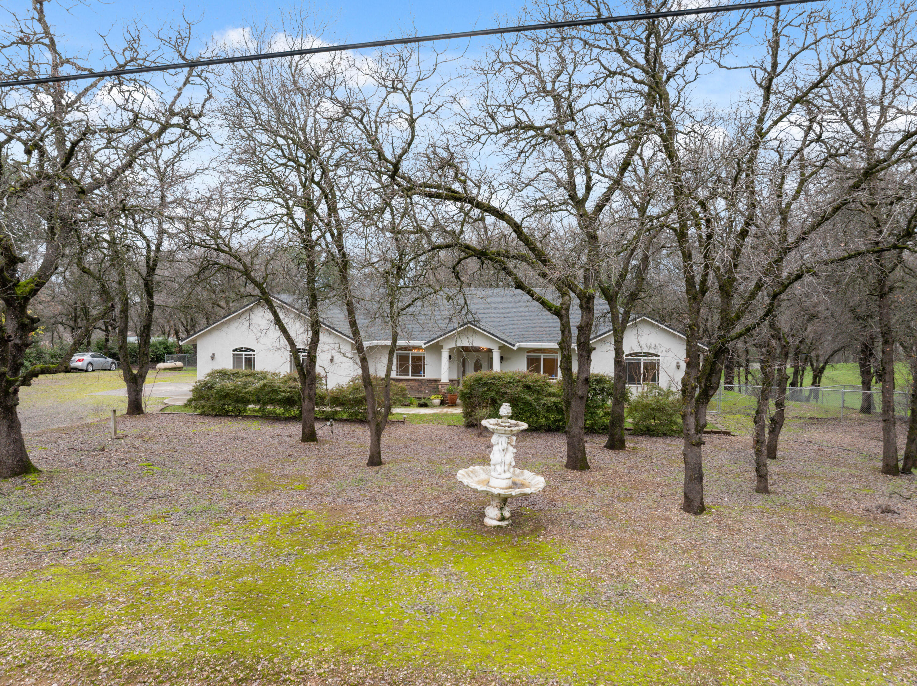 14535 Molluc Drive Red Bluff, CA 96080 - Photo 47 of 72 a view of a house with a yard patio and fire pit
