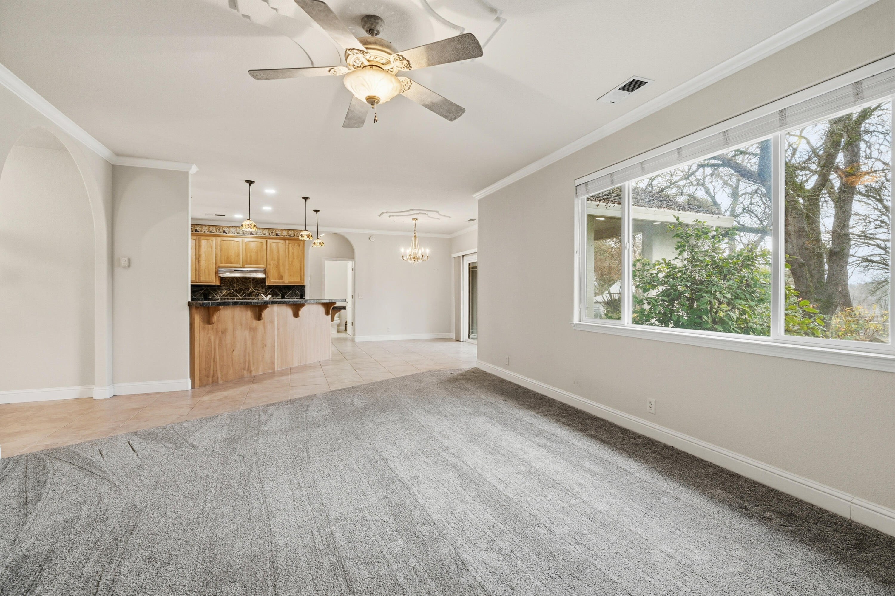 14535 Molluc Drive Red Bluff, CA 96080 - Photo 7 of 72 a view of a livingroom with furniture a ceiling fan and window