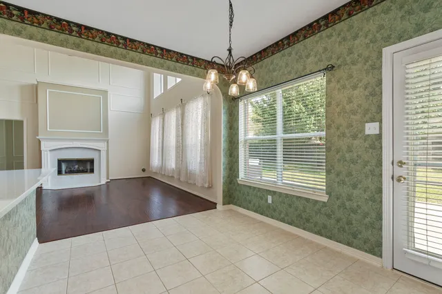 a view of livingroom with window hardwood floor and a ceiling fan