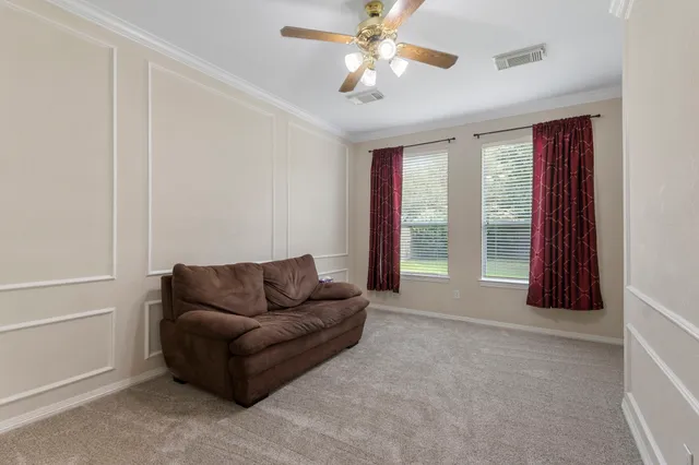 a living room with furniture and a window