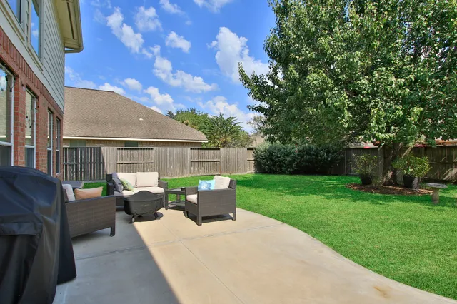 a view of backyard with seating space