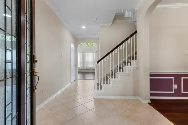 a view of entryway and hall with a view of hallway