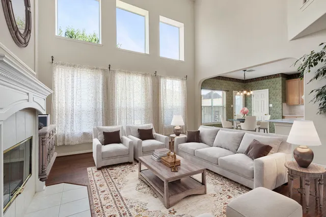 a living room with furniture and a fireplace
